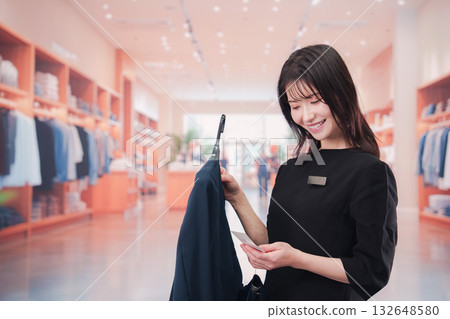 A young female staff member working at an apparel store A young female staff member working at an apparel store 132648580