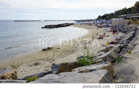 Sanremo, Italy - People enjoy the hot summer sun on a beach Sanremo, Italy - People enjoy the hot summer sun on a beach 132648722