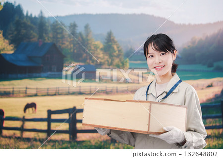 A young farmer woman working in a large farm A young farmer woman working in a large farm 132648802
