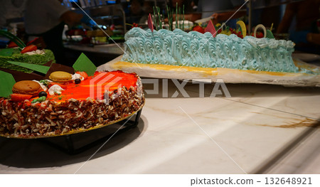 Dining Room Buffet aboard the abstract luxury cruise ship. Selective focus. Sweet cakes 132648921