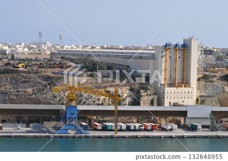 Malta - Cranes at the Paola Dockyard on the Grand Harbour. Malta - Cranes at the Paola Dockyard on the Grand Harbour. 132648955