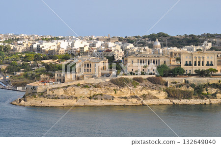 The historic Bighi Complex in Kalkara, Malta, featuring imposing architecture and coastal views along Triq Marina. Cultural heritage of Malta The historic Bighi Complex in Kalkara, Malta, featuring imposing architecture and coastal views along Triq Marina. Cultural heritage of Malta 132649040