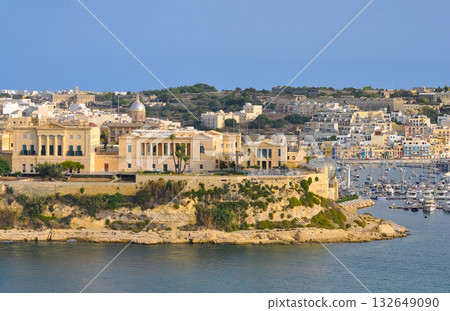 The historic Bighi Complex in Kalkara, Malta, featuring imposing architecture and coastal views along Triq Marina. Cultural heritage of Malta The historic Bighi Complex in Kalkara, Malta, featuring imposing architecture and coastal views along Triq Marina. Cultural heritage of Malta 132649090