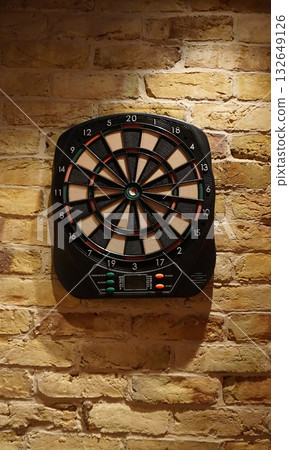 Electronic dart board isolated on wall background 132649126