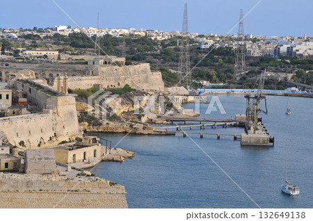 Aerial view of Fort Ricasoli East Breakwater. Waves, Mediterranean sea. Malta island Aerial view of Fort Ricasoli East Breakwater. Waves, Mediterranean sea. Malta island 132649138