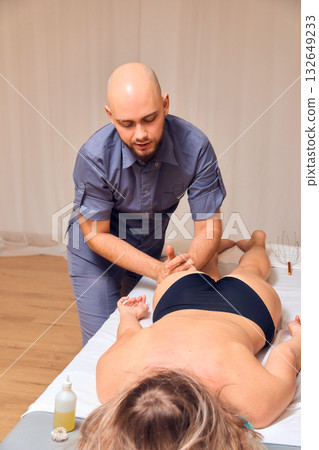 Engaging in a Professional Massage Therapy Session Focused on Client Relaxation and Comfort 132649233