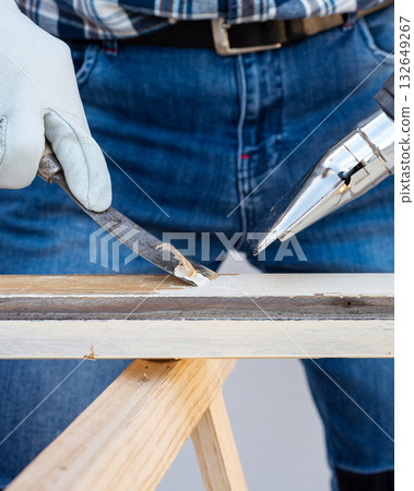Carpenter at work, restoring an old wooden window. Carpentry. 132649267