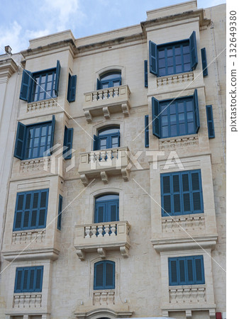 View of old building with windows, balconies in city. Republic of Malta, the picturesque city of Valetta, Malta. 132649380