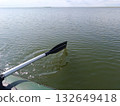 A paddle against a river. A rowboat ride. 132649418