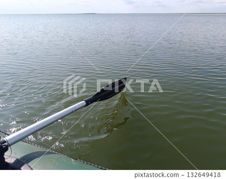 A paddle against a river. A rowboat ride. 132649418
