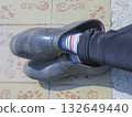 Feet in galoshes 132649440