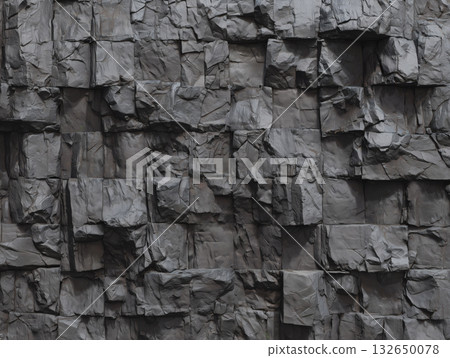 A wall texture made of stacked rugged dark gray stones with three-dimensional shadows A wall texture made of stacked rugged dark gray stones with three-dimensional shadows 132650078