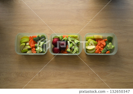 Set of fresh vegetables and fruits in food storage containers Set of fresh vegetables and fruits in food storage containers 132650347
