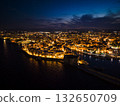 Night view of the illuminated historic center, harbor, and Carlo V Castle in Monopoli, Italy 132650709