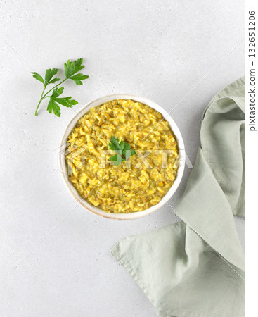 Indian khichdi, kichari with rice and mung bean groats on white background. Top view. Ayurveda diet. Indian food. 132651206