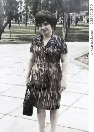 Vintage portrait of a young attractive woman dressed in 1970s fashion. Retro photo from 1975. Vintage portrait of a young attractive woman dressed in 1970s fashion. Retro photo from 1975. 132651549