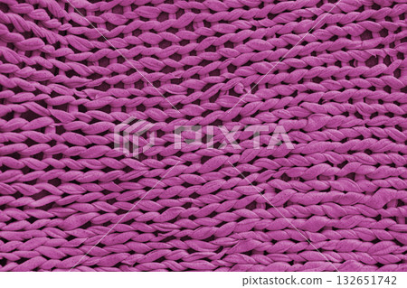 Closeup, macro pink knitted fabric, cloth texture background with thick yarn pattern surface Closeup, macro pink knitted fabric, cloth texture background with thick yarn pattern surface 132651742