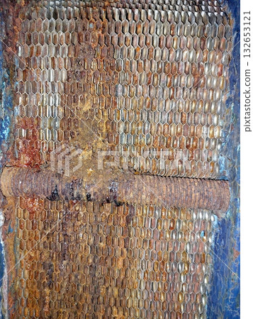 Detailed View of a Worn Industrial Plate Heat Exchanger Showing Corrosion and Residue 132653121