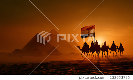Egyptian Flag Carried by Camel Caravan at Sunset with Pyramids Silhouetted in Background 132653755