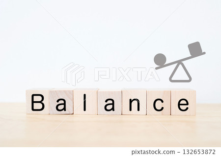Illustration of a seesaw with wooden blocks showing balance. 132653872