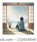 A woman relaxing by the window gazing at the snow 132654044