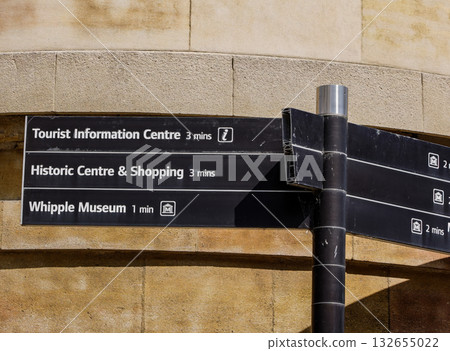 Close up view of a signpost indicating directions and walking times to points of interest in Cambridge, UK 132655022