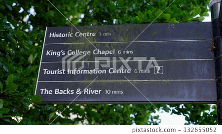 Tourist sign indicating distances to Cambridge attractions, including King s College Chapel and The Backs 132655052