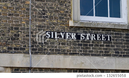 Silver Street sign in Cambridge, UK, indicating a historic location with brick wall and window 132655058