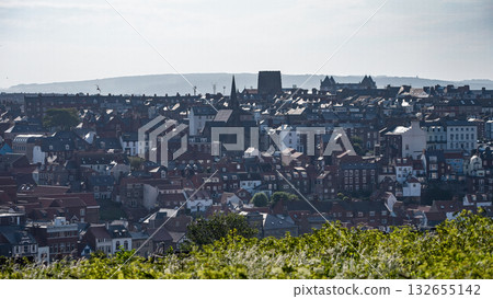 Whitby cityscape overlooking rooftops and North York Moors National Park 132655142