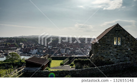 Stone cottage overlooking Whitby harbor in North York Moors National Park 132655148