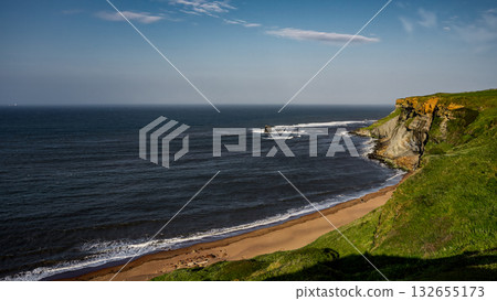 Scenic view of Whitby coastline embracing North York Moors National Park in England Scenic view of Whitby coastline embracing North York Moors National Park in England 132655173