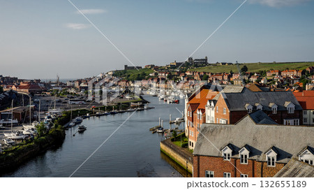 Whitby harbor with boats and Saint Mary s Church on a sunny summer day 132655189