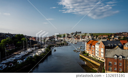 Whitby harbor with boats and St. Mary s Church overlooking the North York Moors National Park 132655191