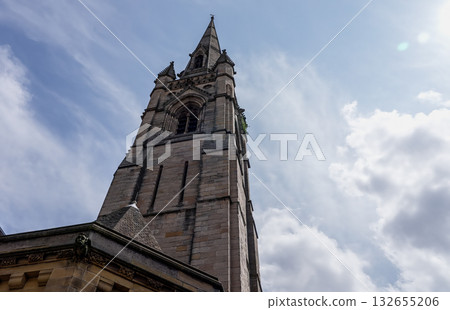 St. Nicholas Cathedral rising towards cloudy sky in Newcastle, UK 132655206