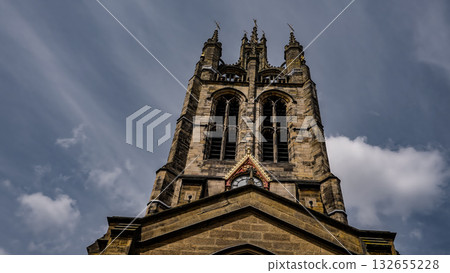 St. Nicholas Cathedral rising towards a cloudy sky in Newcastle, UK 132655228
