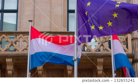 Luxembourg and european union flags waving in Luxembourg City Luxembourg and european union flags waving in Luxembourg City 132655241