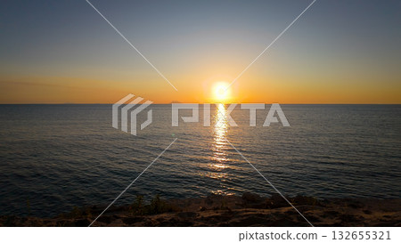 Stromboli Volcano emerging from the Tyrrhenian Sea at sunset, seen from Tropea, Calabria, Italy Stromboli Volcano emerging from the Tyrrhenian Sea at sunset, seen from Tropea, Calabria, Italy 132655321
