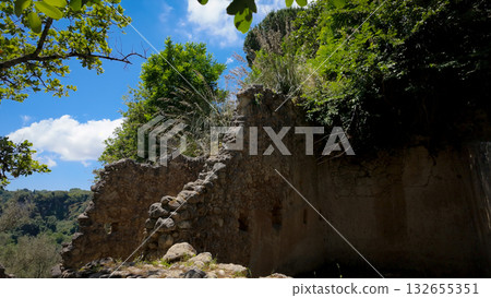 Ancient rupestrian church immersed in the vegetation of Zungri, Calabria, Italy Ancient rupestrian church immersed in the vegetation of Zungri, Calabria, Italy 132655351