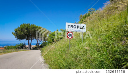 Road entering Tropea, Calabria, with Tyrrhenian Sea and pine trees in background Road entering Tropea, Calabria, with Tyrrhenian Sea and pine trees in background 132655356