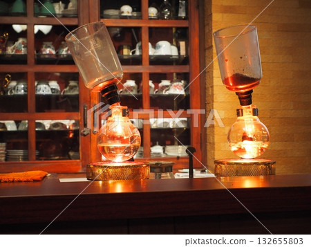 The glow of amber as the flames light: the siphoning ritual begins in a line The glow of amber as the flames light: the siphoning ritual begins in a line 132655803
