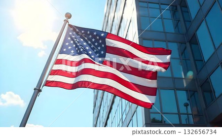 An American flag flies proudly in front of a building, celebrating Labor Day and the contributions of workers in the U.S 132656734