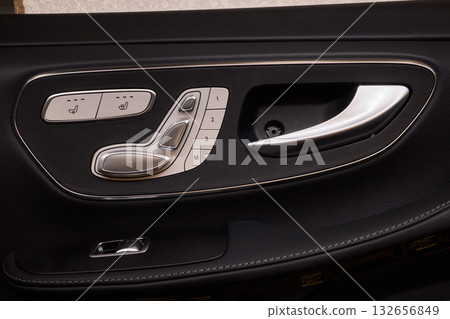 A car door with trim showcasing automotive design details A car door with trim showcasing automotive design details 132656849
