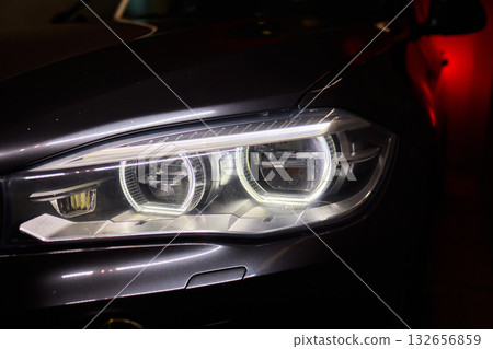 Close up of a cars headlight, part of automotive design 132656859