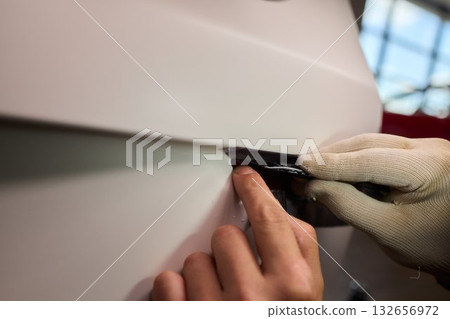 Applying a Protective Film on the Surface of Your Car for Enhanced Durability and Shine 132656972