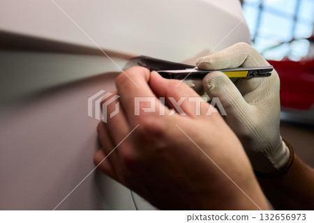 Applying a Protective Film on the Surface of Your Car for Enhanced Durability and Shine 132656973