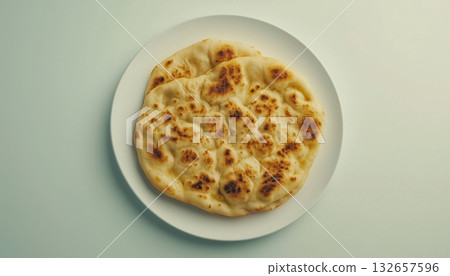 Flat bread on white plate homemade for simple food flay lay light background 132657596