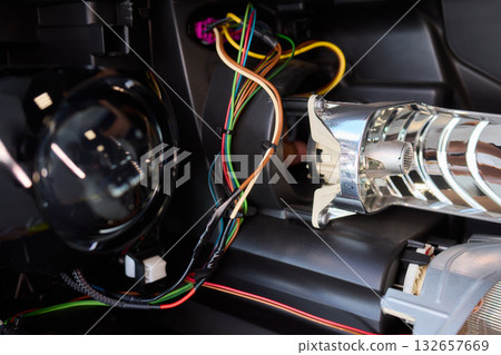 Careful precision is essential when installing a car headlight assembly for optimal performance Careful precision is essential when installing a car headlight assembly for optimal performance 132657669