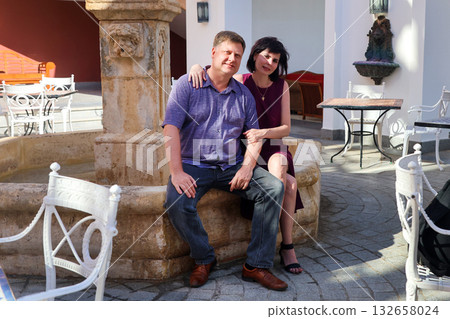 Beautiful married adult couple husband and wife in a street Italian restaurant 132658024