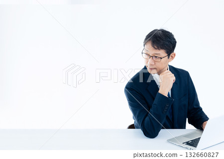 Middle-aged businessman working on a computer 132660827