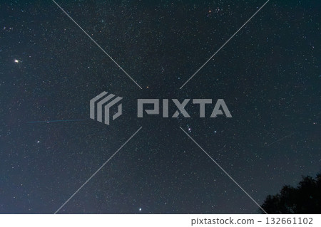 Clear starry night sky with Orion constellation and bright stars visible Clear starry night sky with Orion constellation and bright stars visible 132661102